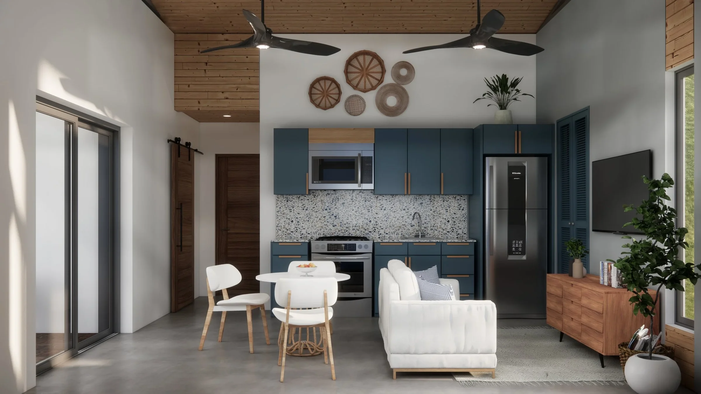Modern living space with an open-concept kitchen and dining area. Blue cabinets, gray speckled backsplash, stainless steel refrigerator, microwave, oven, and black sink. White armchair with blue and white pillows, wooden sideboard, large flat-screen
