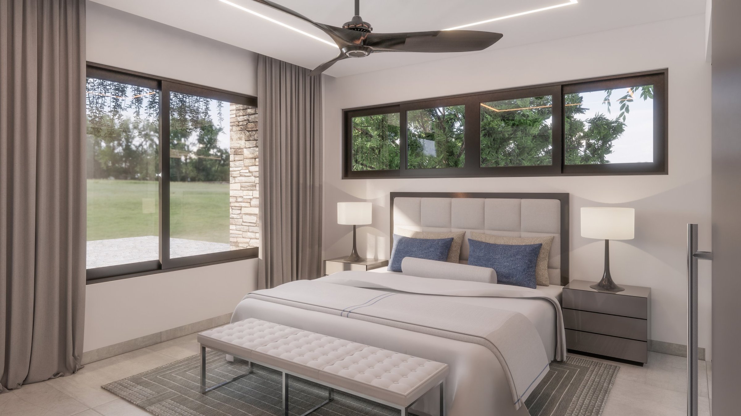 Modern bedroom with large windows, white bed, gray nightstands, lamps, a tufted bench at the foot of the bed, and ceiling fan.