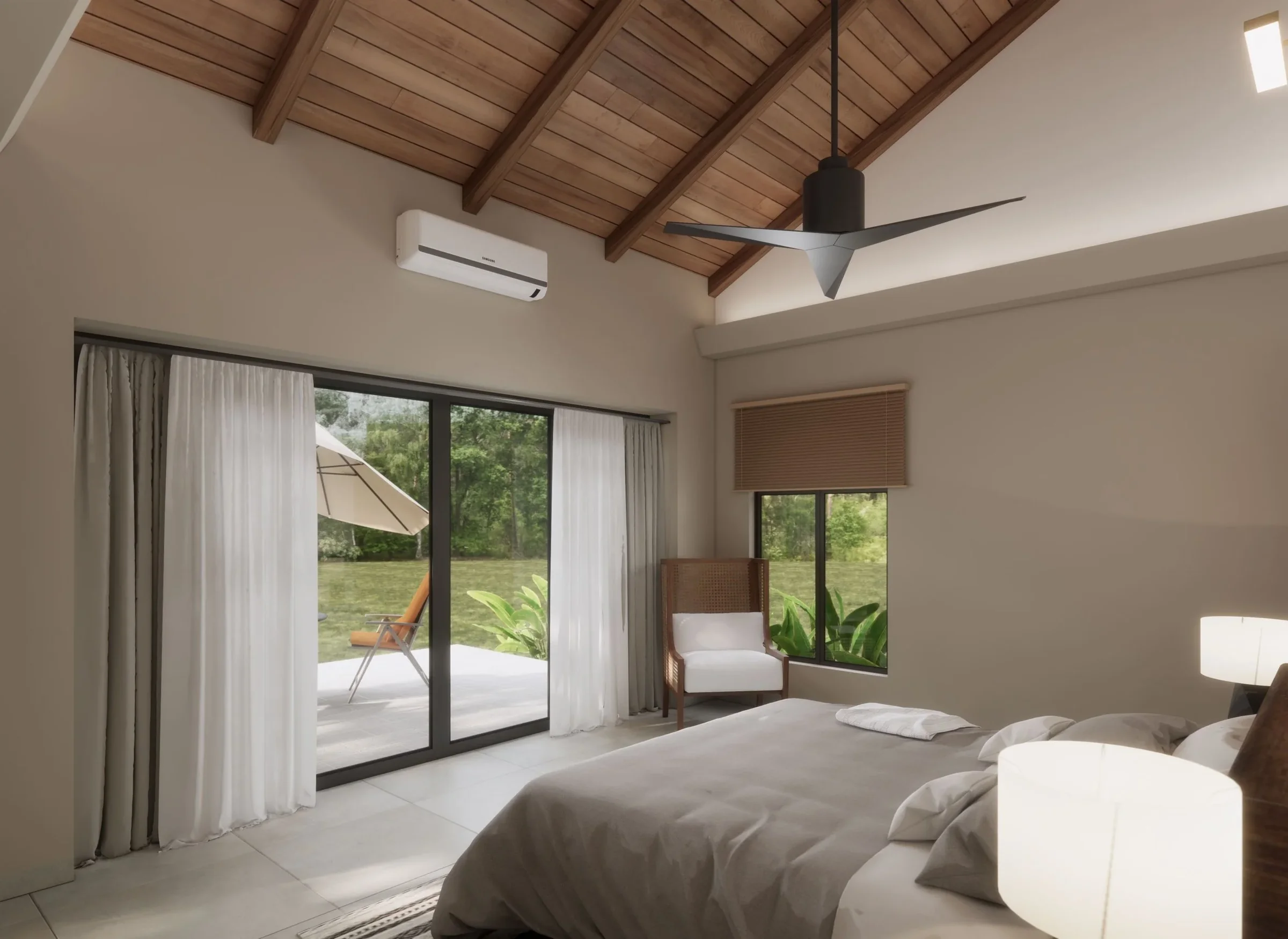 A bedroom with a bed, pillows, and a bedside lamp. It has large glass sliding doors opening to a patio with an outdoor lounge chair and umbrella, and a window with a wooden blind. The ceiling is wooden with exposed beams, a modern ceiling fan, and an