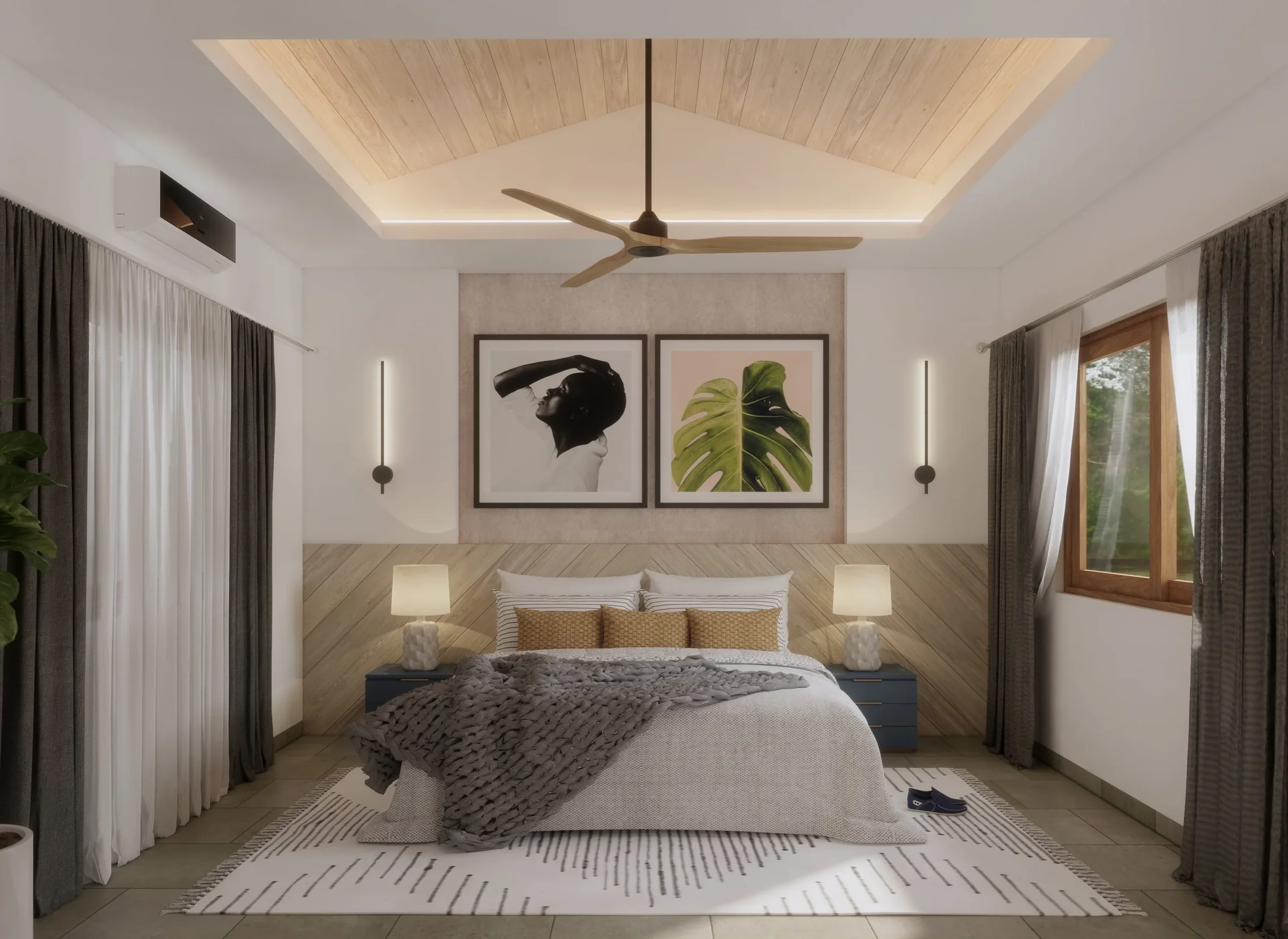 Modern bedroom with a wooden bed, two nightstands with lamps, framed black and white and green leaf artwork above the bed, dark curtains, large windows, ceiling fan, and a beige and white color scheme.