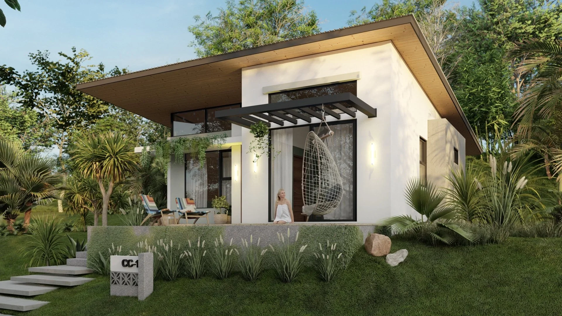 Modern house with large glass sliding doors and an outdoor hanging swing chair, surrounded by lush greenery and tropical plants.