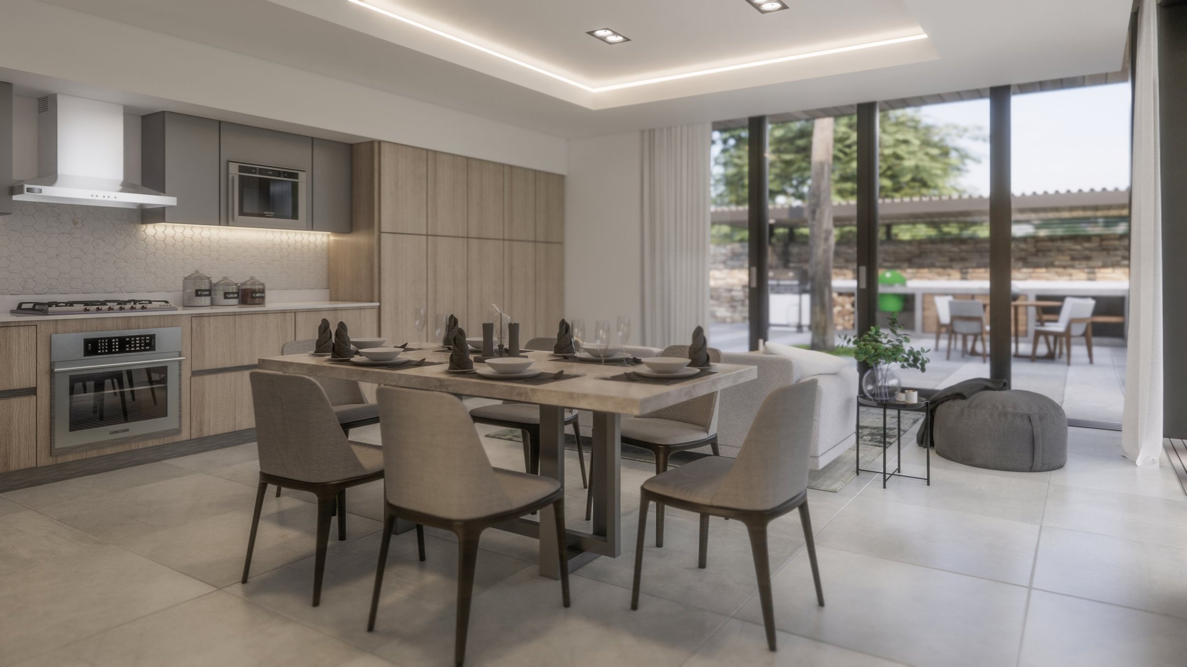 Modern, open-concept kitchen and dining area with a view of a patio outdoors. The kitchen has light wood cabinetry, a stainless steel oven, and a microwave. The dining table is set with napkins, plates, and glassware, surrounded by beige chairs. Larg