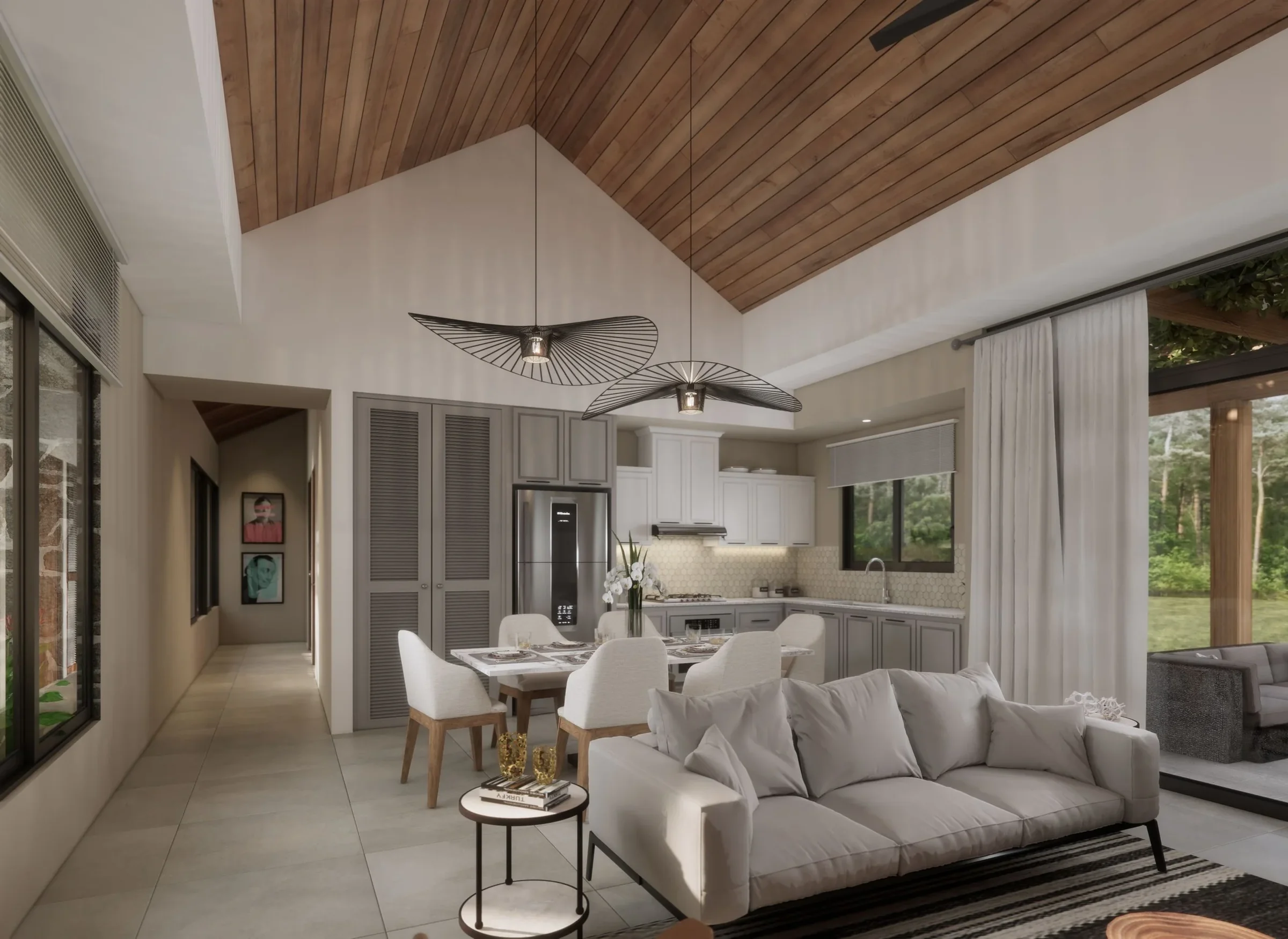Modern open-concept living and kitchen area with vaulted wood ceiling, white walls, tiled floor, white sofa, dining table with six chairs, and large windows with curtains showing outdoor greenery.