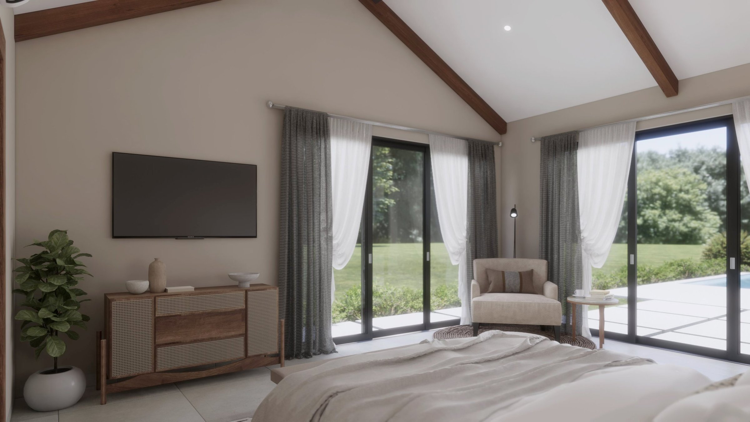 Modern bedroom with large glass sliding doors, beige walls, wooden ceiling beams, a flat-screen TV on the wall, a wooden sideboard, a potted plant, a beige armchair with a pillow, a small side table, and a view of greenery outside.