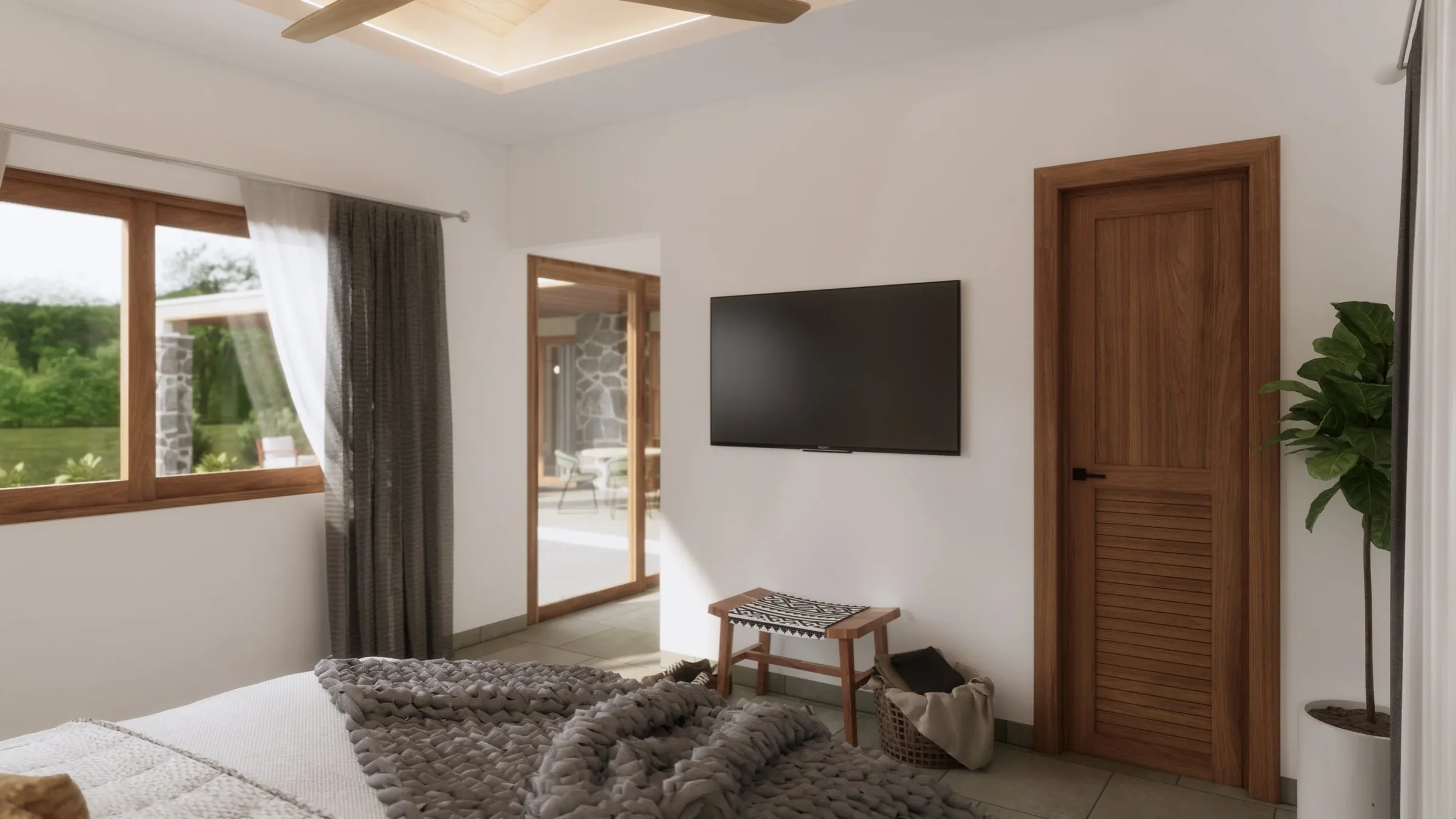 The image shows a bedroom with a window on the left, a wall-mounted TV in the center, and a wooden door on the right. There is a bed at the bottom with a chunky gray blanket, a small wooden bench, and a basket with a cloth near the door. Outside, thr